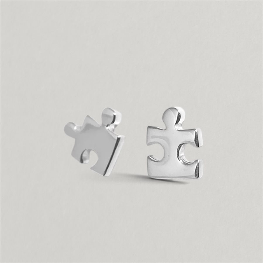 Puzzle Piece Stud Earrings in polished silver