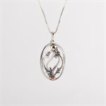 Silver pendant adorned with gold, openwork foliage model 